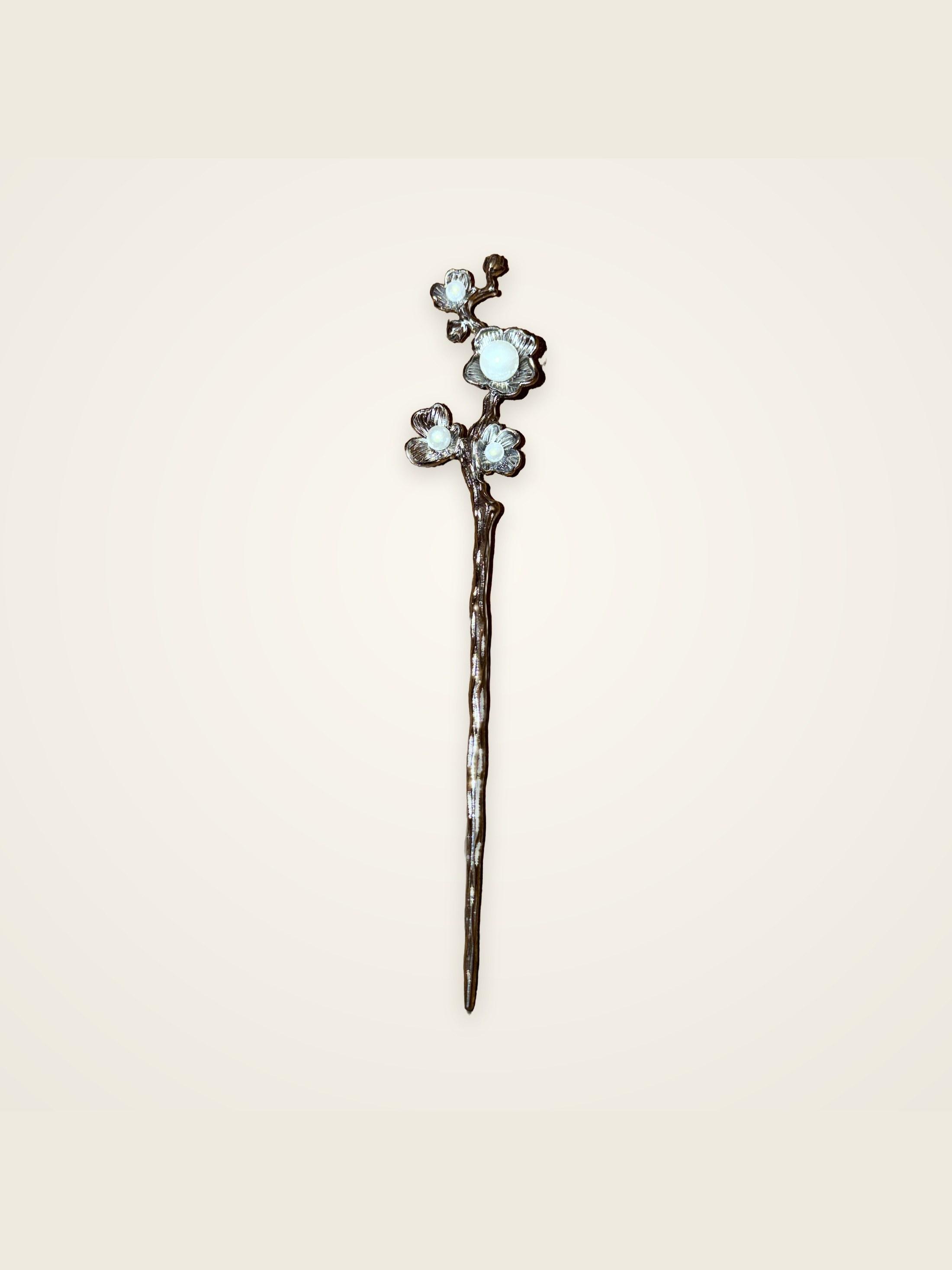 Plum Blossom Hair Stick — dark silver branch with four blossoms, each with a pearl centre